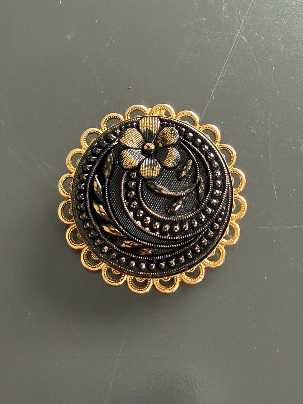 Vintage ornate round brooch black glass filigree etched floral design Art Deco